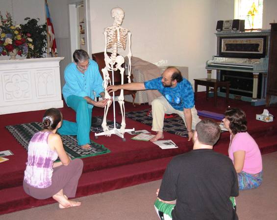 Larry Terkel and Matt Lerner lead a class on anatomy with a class of Yoga Teacher trainees